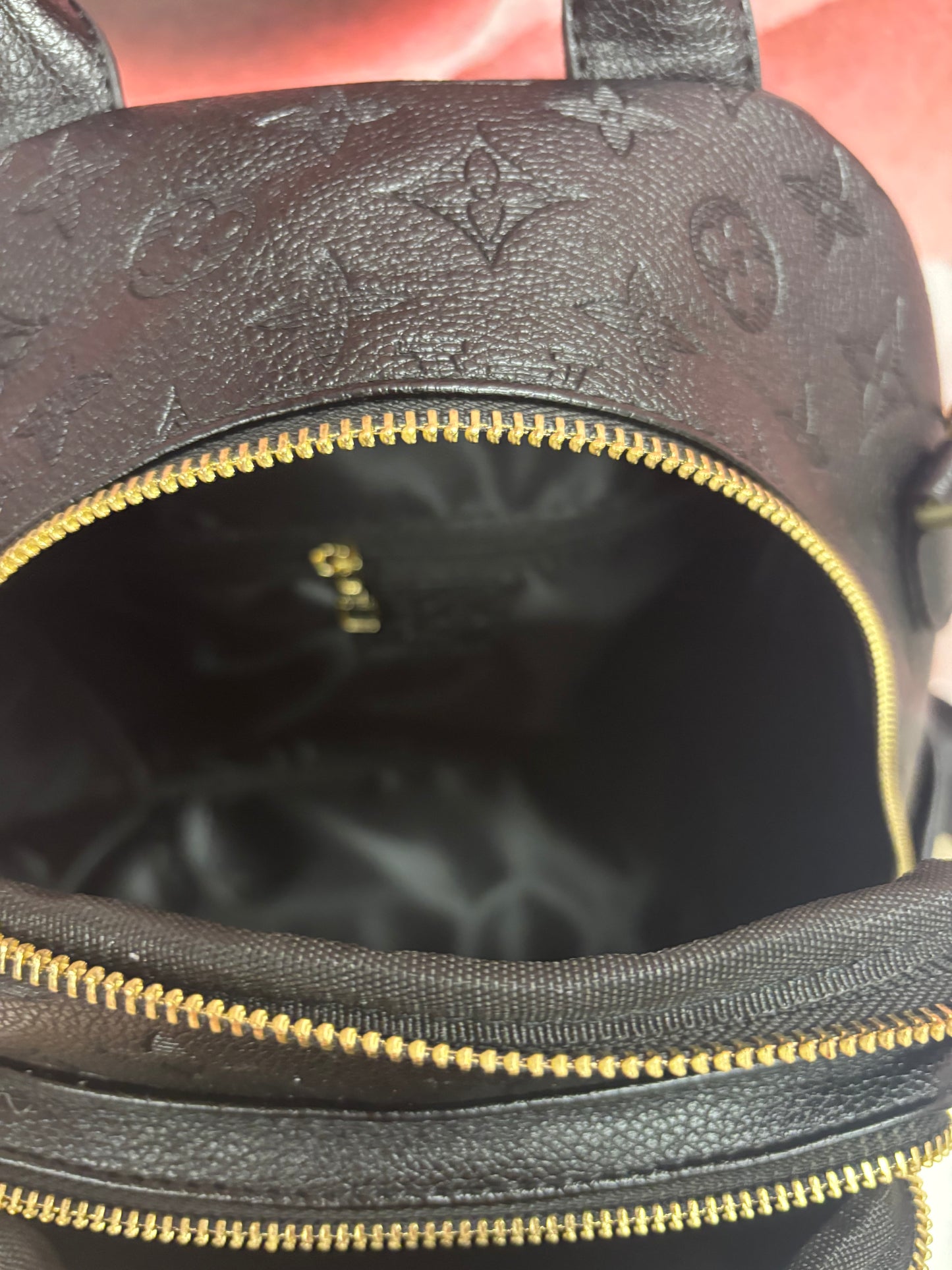 Inspired Embossed Monogram Mini Backpack